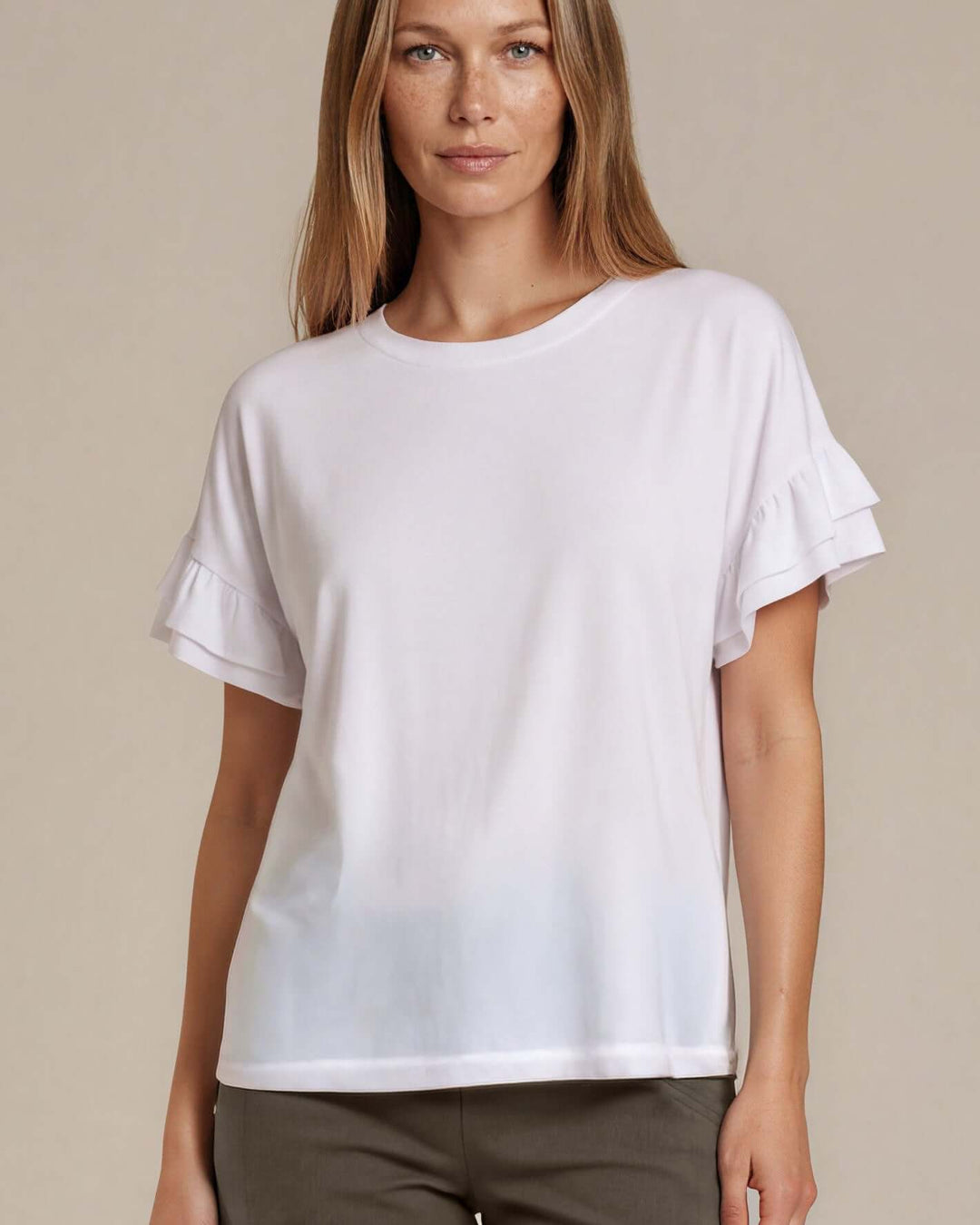 Shop the Ruffle Sleeve T-Shirt in white. Oversized fit, double flutter sleeves, crew neck. 95% Cotton, 5% Spandex. S–L. Made in USA. Free shipping may apply.