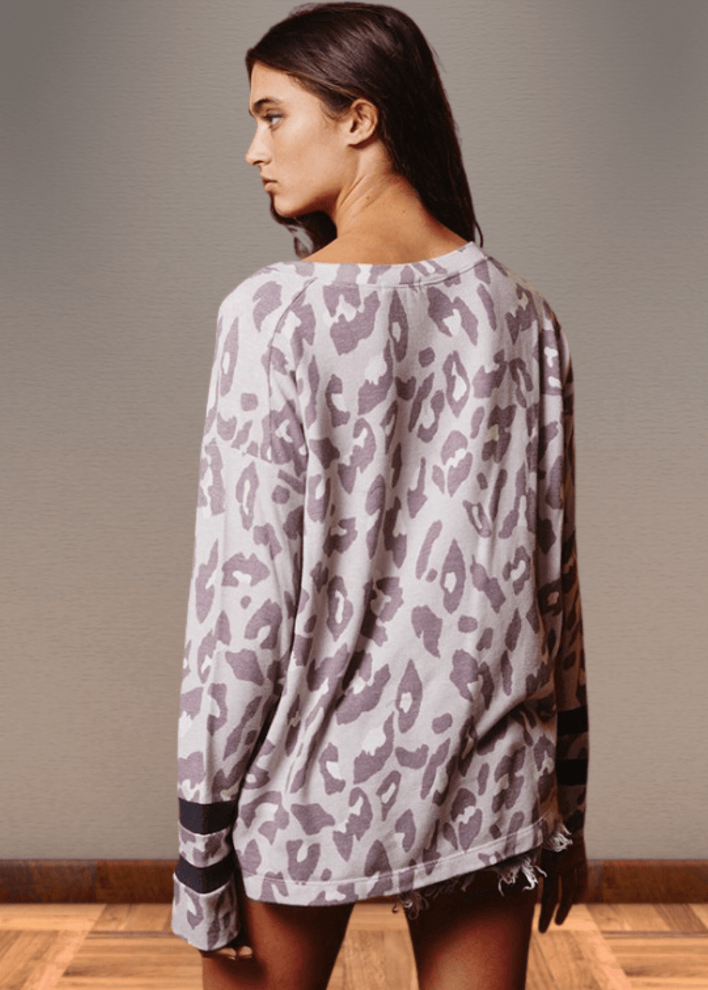 Experience effortless style with the Dusty Lavender Animal Print Top. Its wide round neckline and relaxed fit provide comfort without compromising on fashion.  Bucket List Style T1100