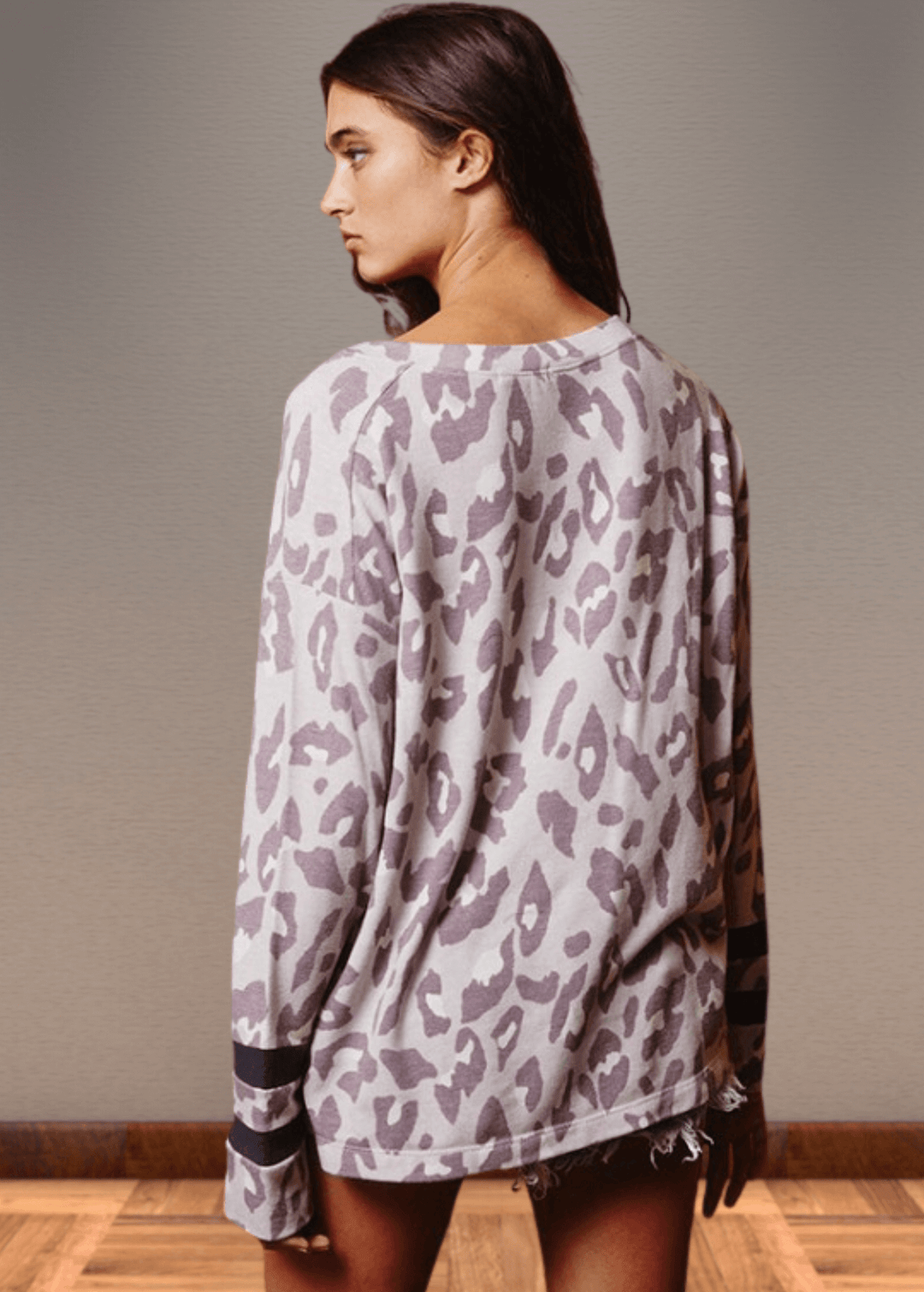Experience effortless style with the Dusty Lavender Animal Print Top. Its wide round neckline and relaxed fit provide comfort without compromising on fashion.  Bucket List Style T1100