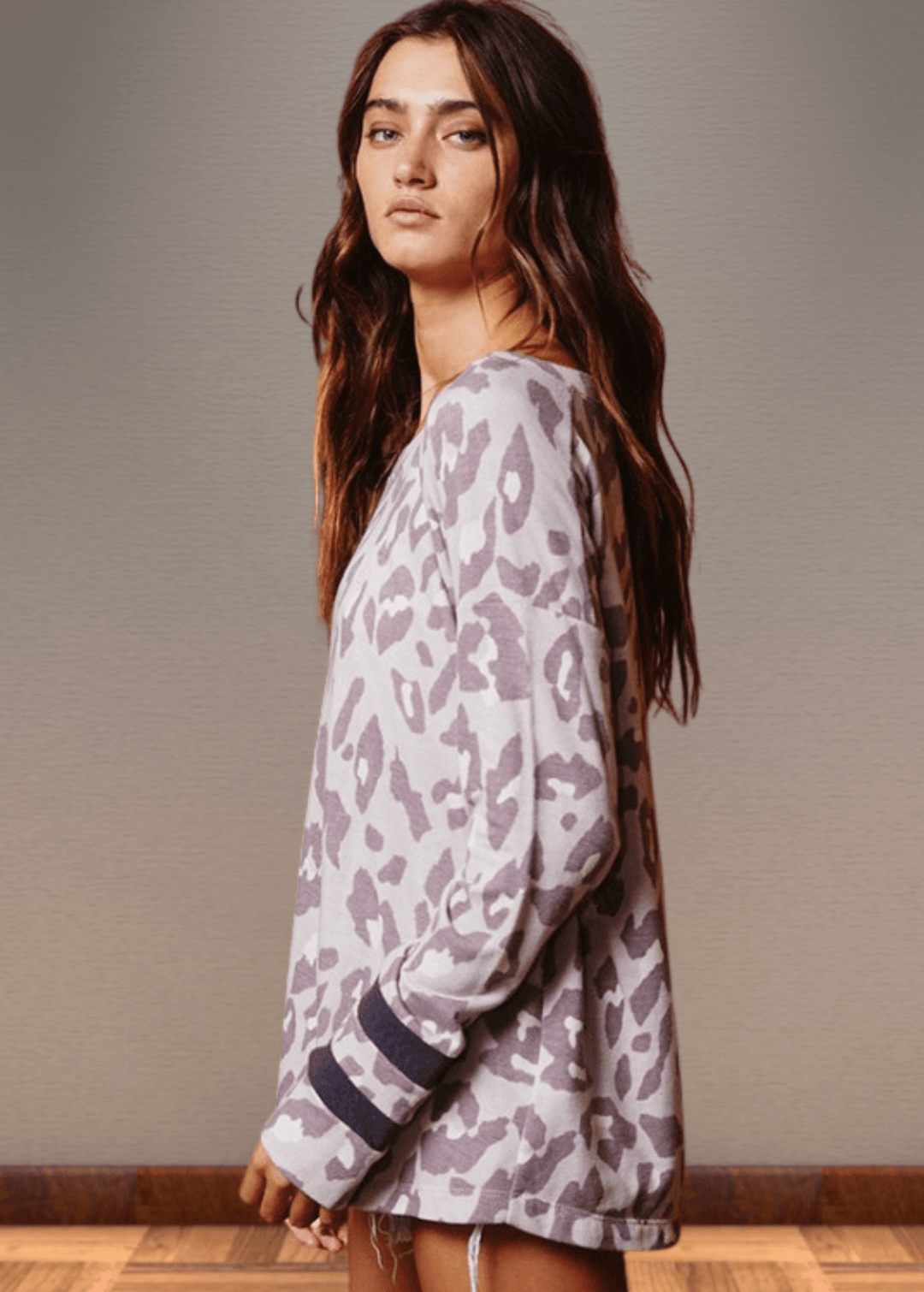 Experience effortless style with the Dusty Lavender Animal Print Top. Its wide round neckline and relaxed fit provide comfort without compromising on fashion.  Bucket List Style T1100