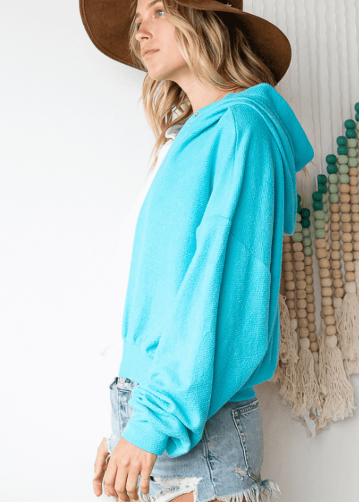 Cozy up in the Gina French Terry Hoodie, where aqua meets light gray in a playful color block design. Its relaxed fit and medium-weight fabric offer just the right amount of warmth, perfect for lounging or layering on cooler days. Bucket List Style
