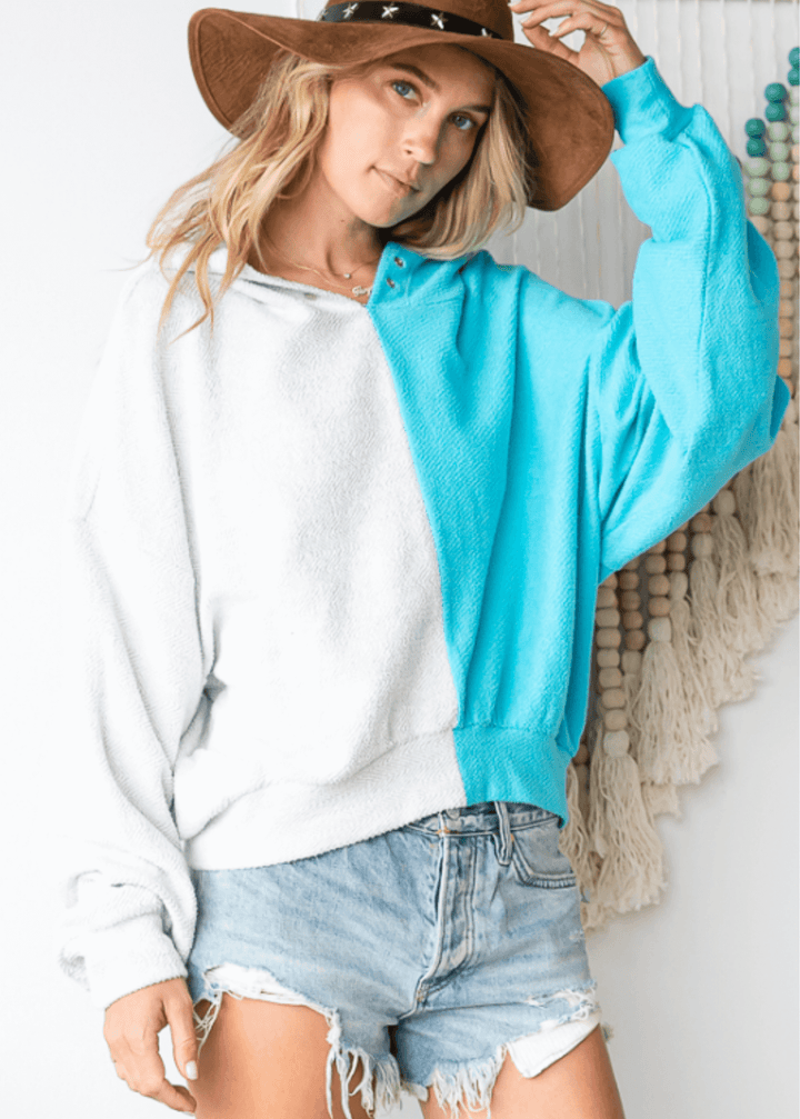 Cozy up in the Gina French Terry Hoodie, where aqua meets light gray in a playful color block design. Its relaxed fit and medium-weight fabric offer just the right amount of warmth, perfect for lounging or layering on cooler days. Bucket List Style