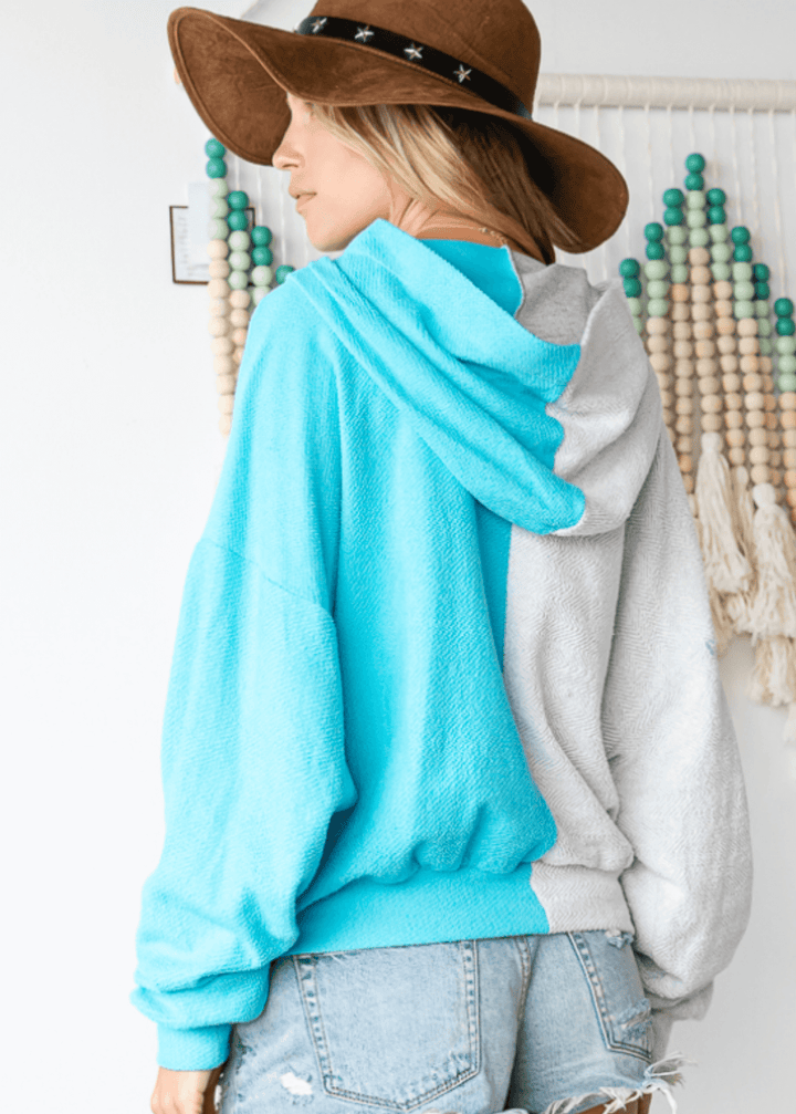 Cozy up in the Gina French Terry Hoodie, where aqua meets light gray in a playful color block design. Its relaxed fit and medium-weight fabric offer just the right amount of warmth, perfect for lounging or layering on cooler days. Bucket List Style
