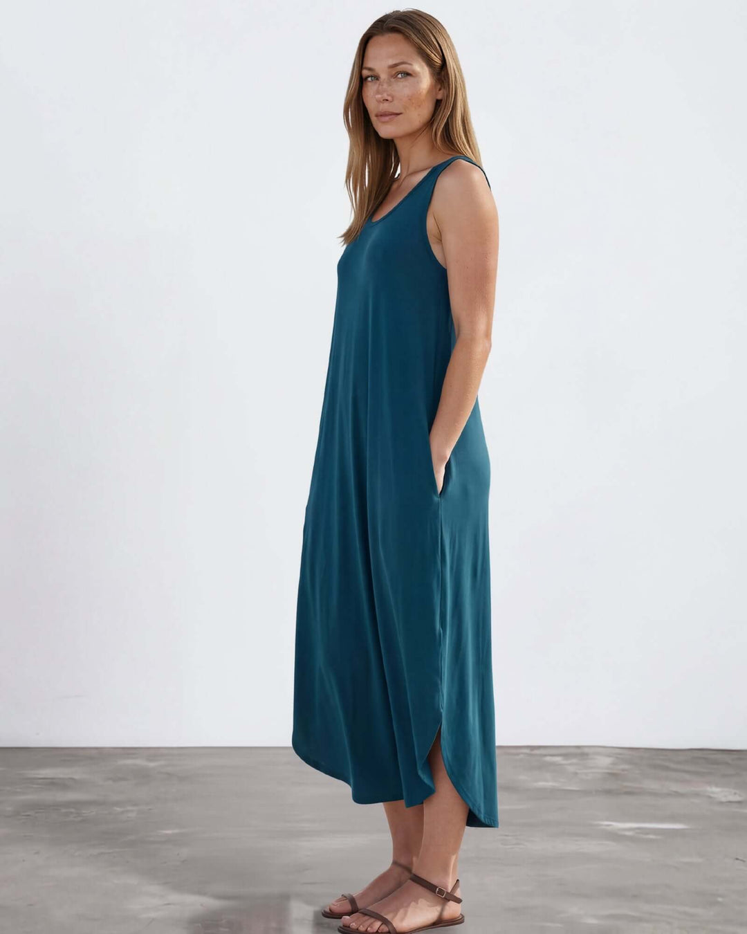 Shop the Sammie Sleeveless Maxi Dress in teal. Relaxed fit, scoop neck, side pockets &amp; slits. 95% Rayon, 5% Spandex. Made in USA. Free shipping may apply.