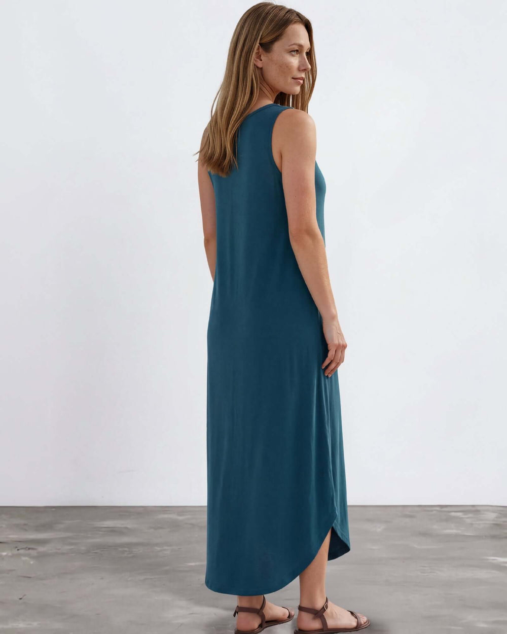 Shop the Sammie Sleeveless Maxi Dress in teal. Relaxed fit, scoop neck, side pockets & slits. 95% Rayon, 5% Spandex. Made in USA. Free shipping may apply.