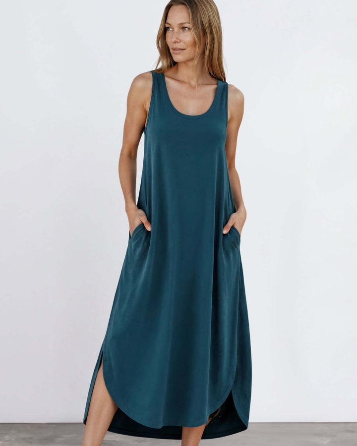 Shop the Sammie Sleeveless Maxi Dress in teal. Relaxed fit, scoop neck, side pockets &amp; slits. 95% Rayon, 5% Spandex. Made in USA. Free shipping may apply.