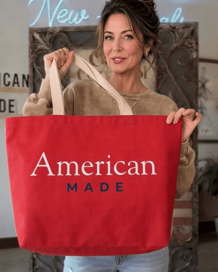 Made in USA. Carry a USA 1776 canvas tote with American Made artwork on the reverse. 12 oz. USA cotton canvas, 20" x 14.5" x 4.5", in Red or Natural.