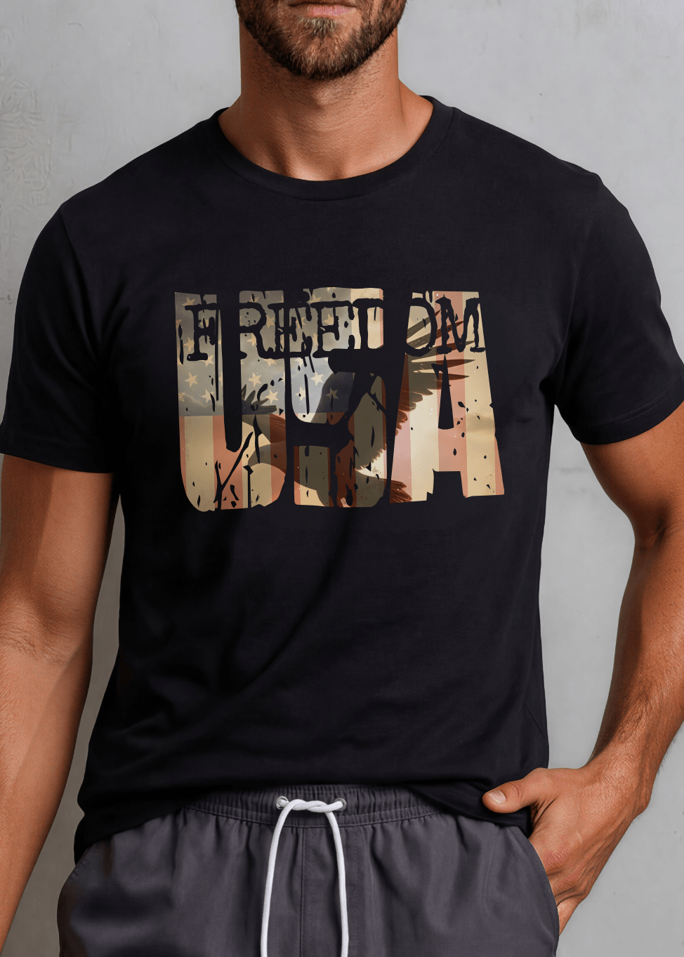 Men's FREEDOM USA patriotic graphic tee in Black or White. Distressed eagle silhouette design. Made in USA with USA-grown cotton. Sizes S–3XL.