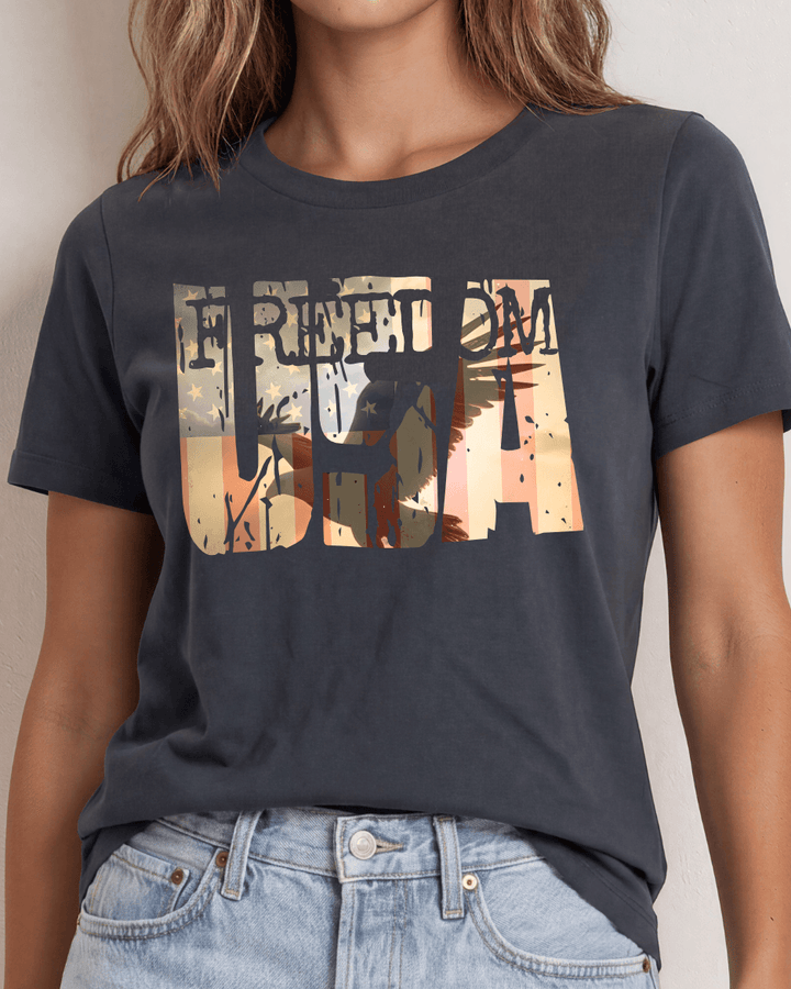 Bold FREEDOM USA soaring eagle sunset graphic tee on graphite. 100% combed ring-spun cotton, USA-milled fabric, made in USA. Perfect for 4th of July.