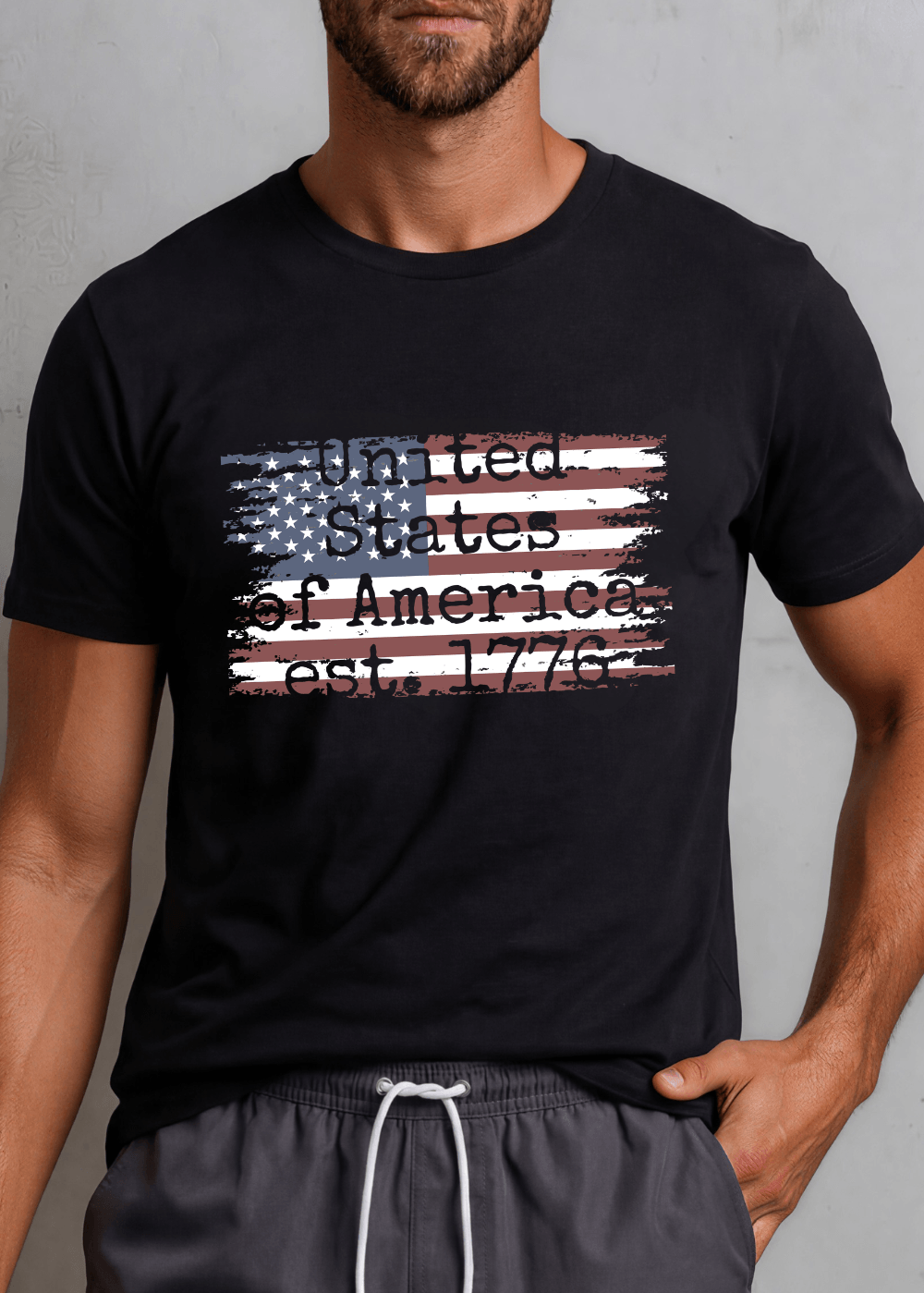Men's distressed American flag graphic tee — "United States of America est. 1776" in Black or Navy. Made in USA, 100% ring-spun cotton, relaxed fit.