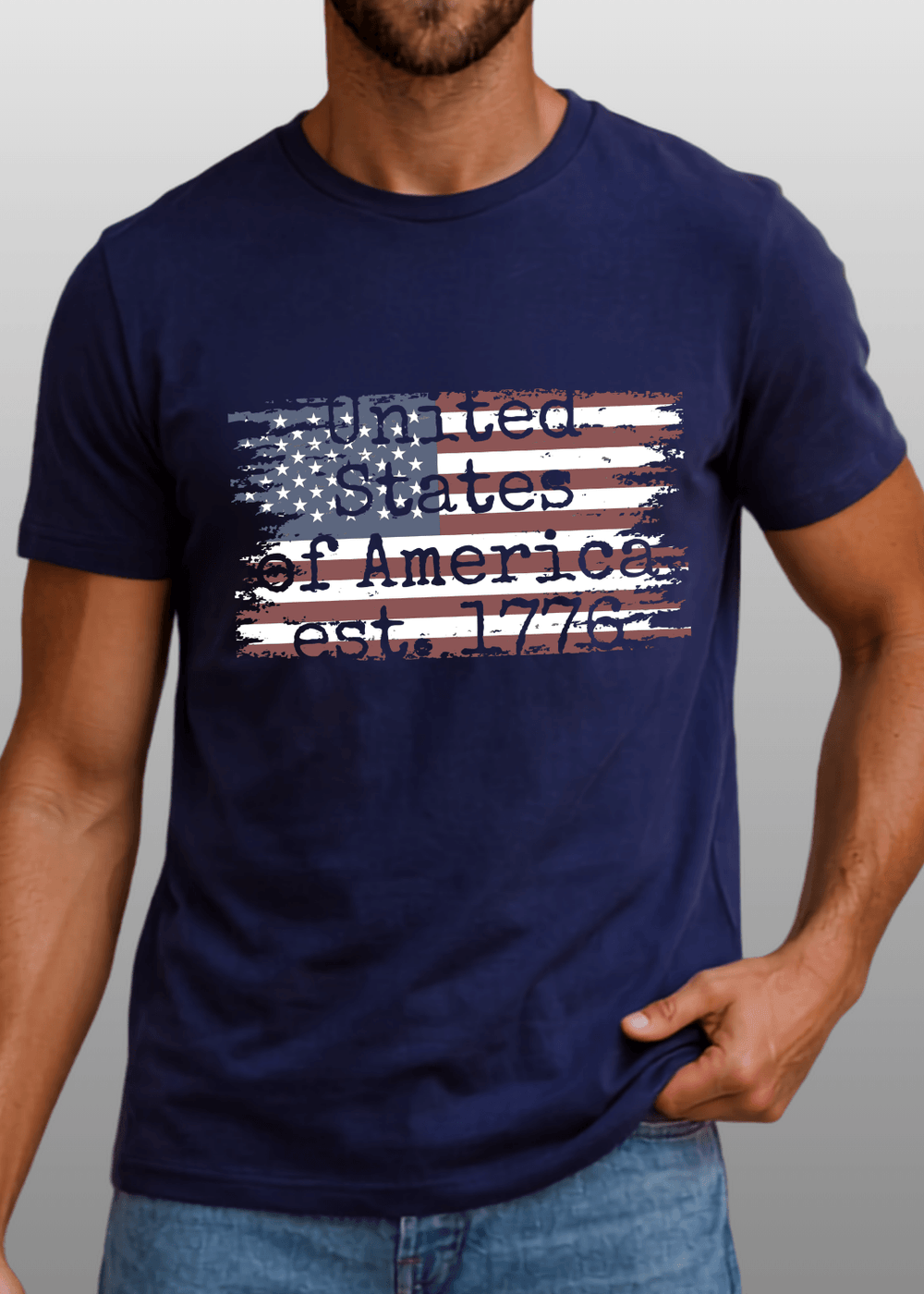 Men's distressed American flag graphic tee — "United States of America est. 1776" in Black or Navy. Made in USA, 100% ring-spun cotton, relaxed fit.
