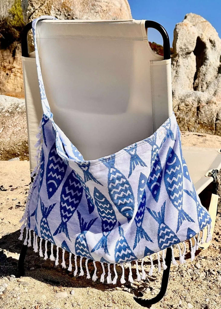Shop the Beachables Pattern 3-in-1 Turkish Cotton Beach Bag – converts from bag to towel to chair cover. Sand-resistant, quick-dry, machine washable. Made in USA.