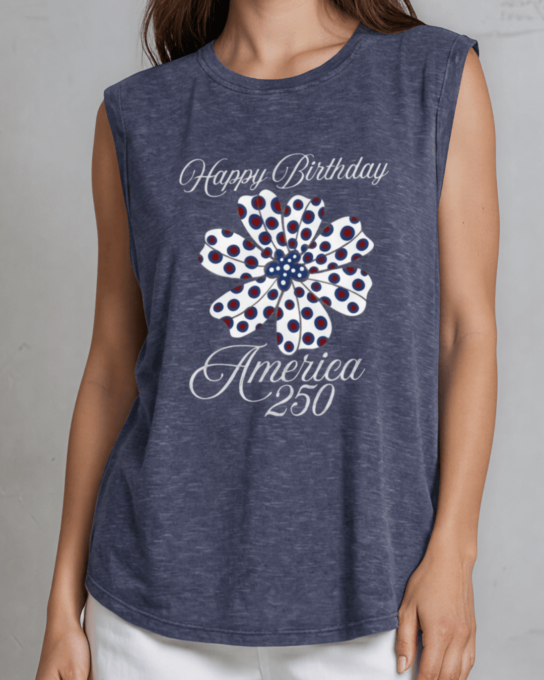 Celebrate America's 250th with this women's relaxed fit patriotic floral graphic muscle tee. Breathable cotton blend, rolled sleeves, navy, made in the USA.