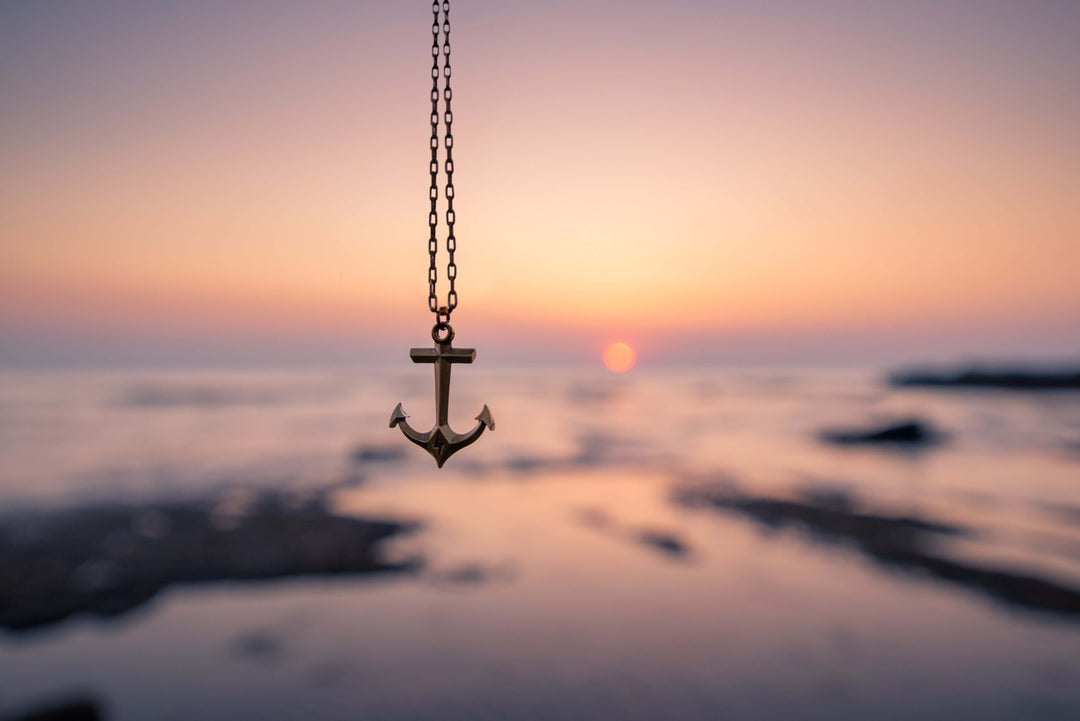 Handcrafted solid bronze anchor necklace on an antique bronze chain. Unisex. Custom lengths available. Made in USA with a lifetime warranty.