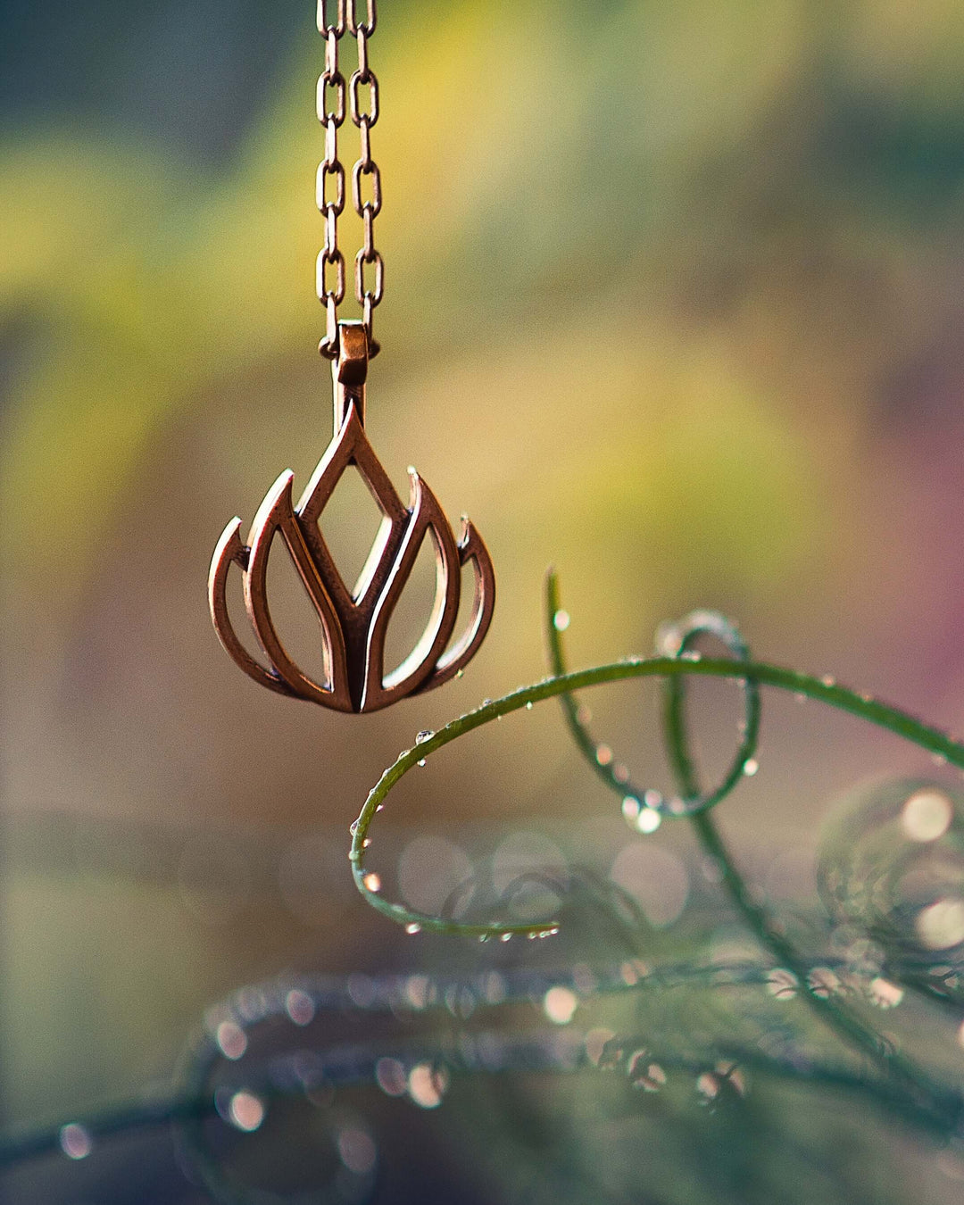 Handcrafted solid bronze lotus flower necklace on an 18 or 24 inch antique bronze chain. Made in USA with a lifetime warranty.