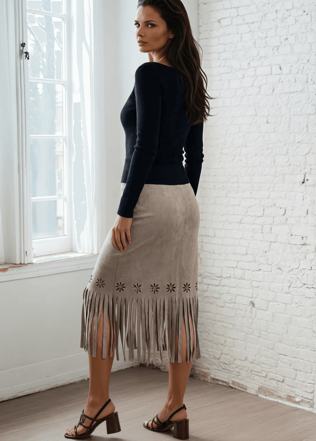 Add a unique piece to your wardrobe with the Leia Laser Cut Fringe Overlay Suede Skirt, a statement piece crafted right here in the USA. This skirt features an intricate laser-cut floral pattern with delicate fringe detailing and a chic wrap overlay silhouette that flatters every figure. 