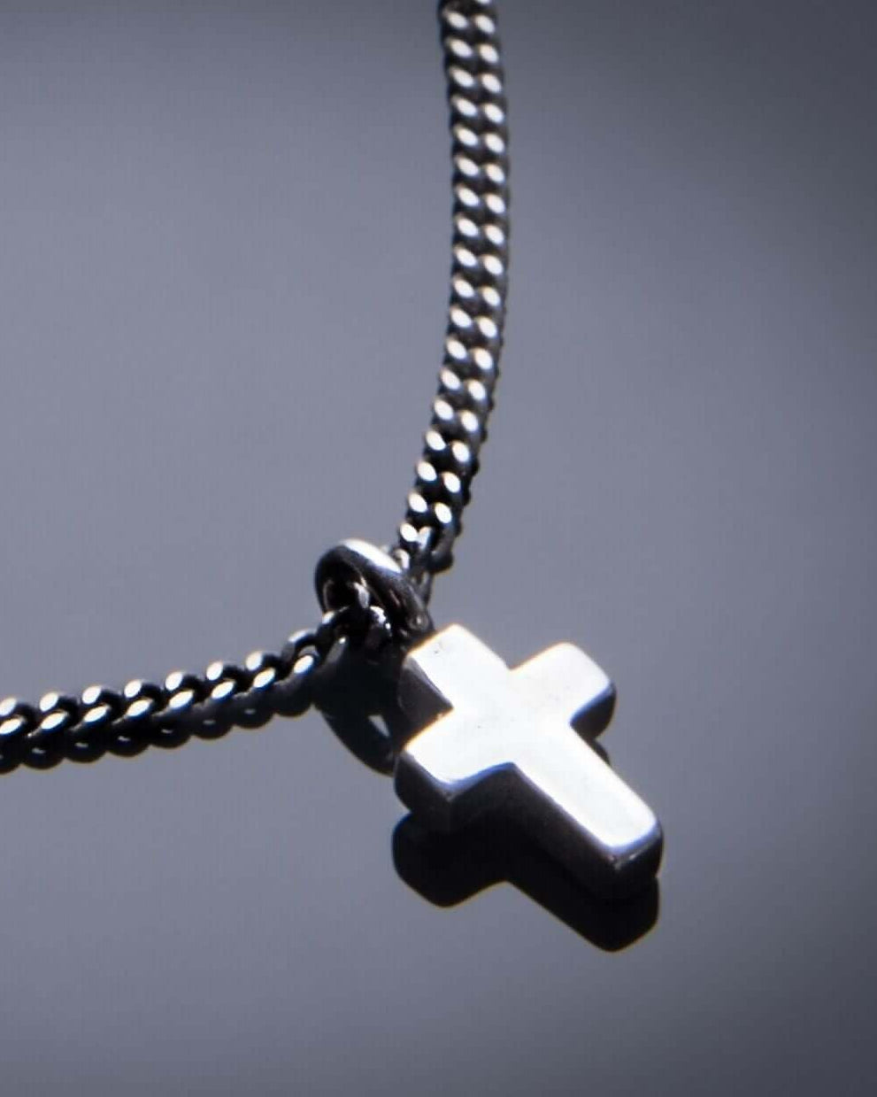 Handcrafted solid sterling silver cross choker necklace on stainless steel. Choker to 22 inch. Made in USA with a lifetime warranty