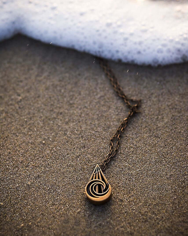 Handcrafted solid bronze mountain wave necklace on an 18 or 24 inch antique bronze chain. Made in USA with a lifetime warranty.
