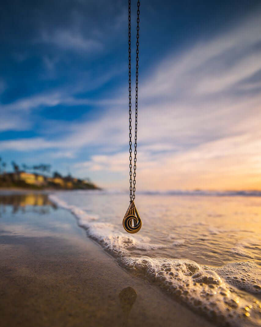 Handcrafted solid bronze mountain wave necklace on an 18 or 24 inch antique bronze chain. Made in USA with a lifetime warranty.