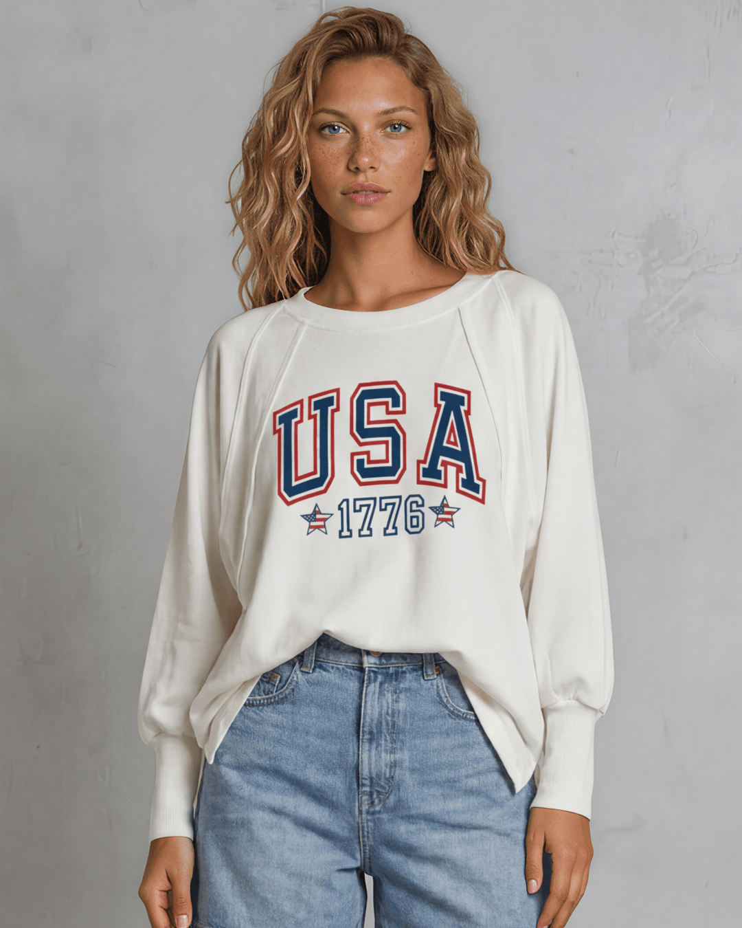 Bold USA 1776 varsity graphic on a soft oversized French terry sweatshirt. Made in USA, 88% cotton, dolman sleeves. Perfect for 4th of July & everyday wear.